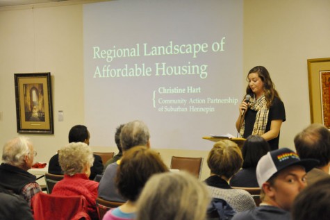 Christine Hart, a community developer, speaks about the struggles of affordable housing at an April 5 meeting at Westwood Lutheran Church. The meeting addressed local concerns over raised rents at the Meadowbrook Manor buildings. 