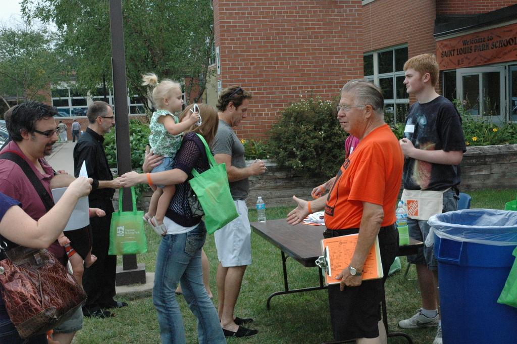 Senior Evan Hill worked as a volunteer collecting donations of $10 in return for a gift bag and an orange Park wristband. Gift bags included a Saint Louis Park magazine, a schedule of events, a map and a water bottle.