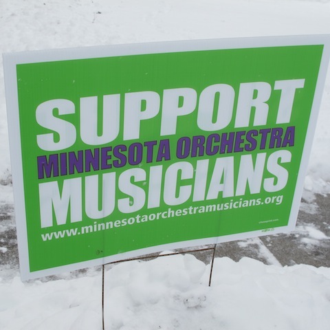 Yard signs show support for orchestra programs.