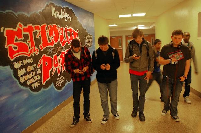 Juniors Avril Bowling, Brian OConnor, Alexander Palamtier, Max Rapp show how often students text while walking. 