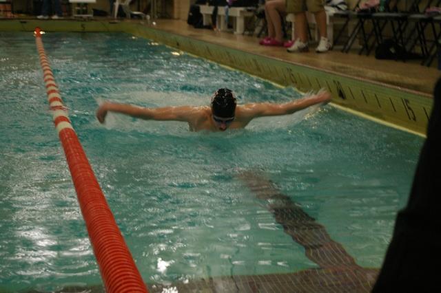 Flying to the finish: Senior Grant Lacey shows off his butterfly at the meet against
Robbinsdale-Cooper Jan. 17 at home. The boys won the meet 54-40.