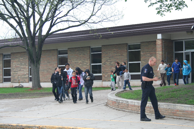 Parents, siblings and students leave Peter Hobart Elementary School after being reunited May 22
