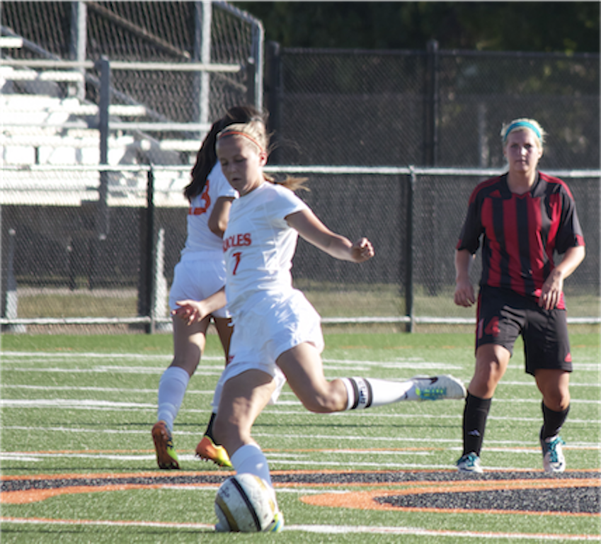 Senior Lauren McManus passes the ball during the girls varsity soccer game August 22. Park won 1-0 and hope to continue winning throughout the season.