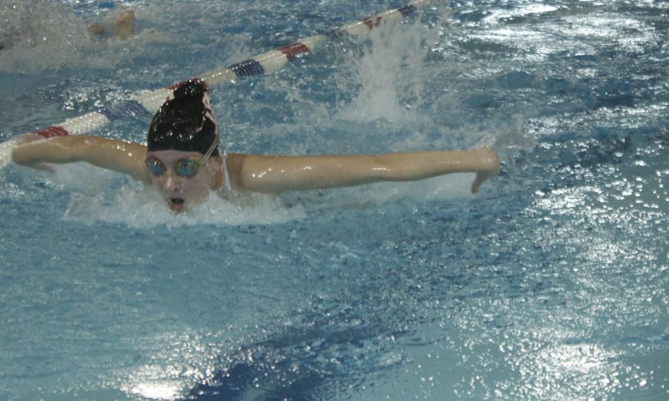 Girls’ swimming suits up for rivalry meet