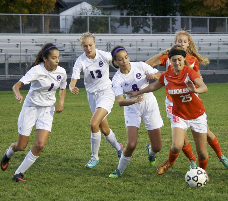 Sophomore Elena Basil blows past Minneapolis Southwest players during their first section game Oct. 10. Emily Hinz scored the winning goal for the 1-0 win.