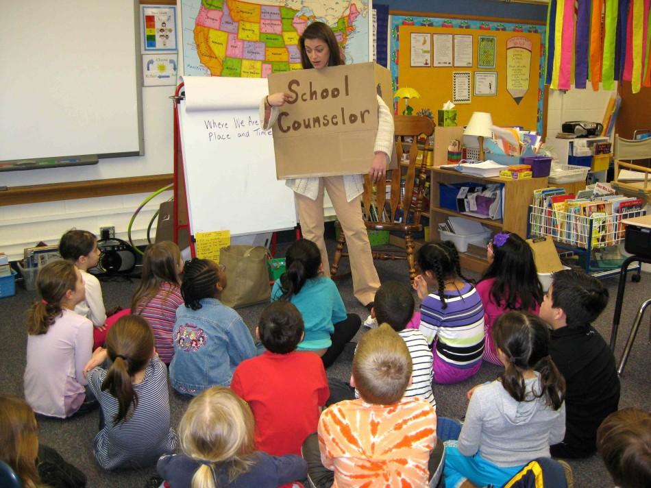 Aquila Elementary School counselor Rachel Nelson teaches second grade students using the book Being Wendy by Fran Drescher.