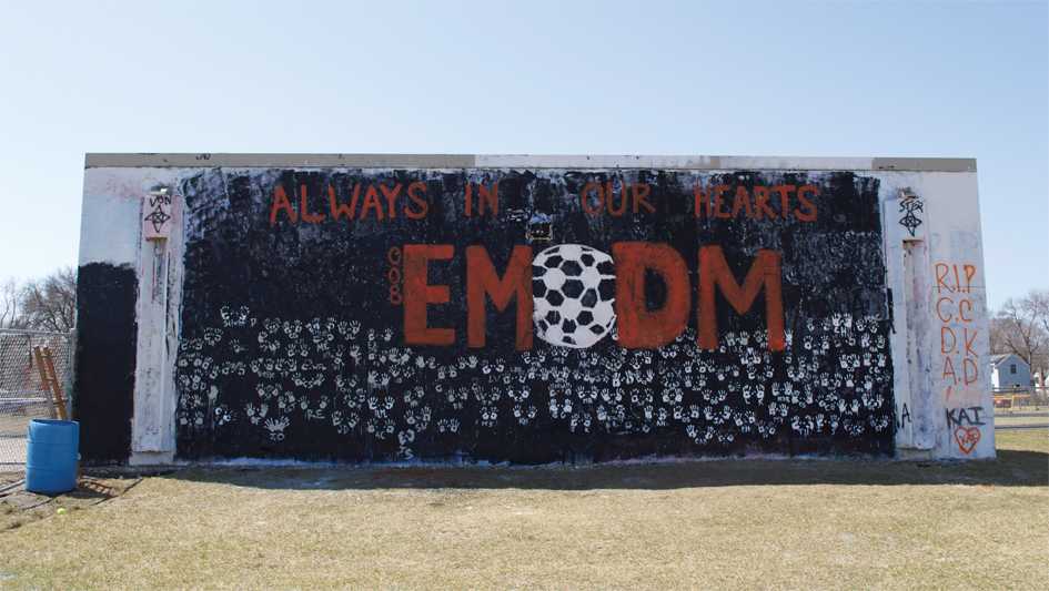 Seniors painted the senior wall in honor of Evan and Damian McManus April 10.