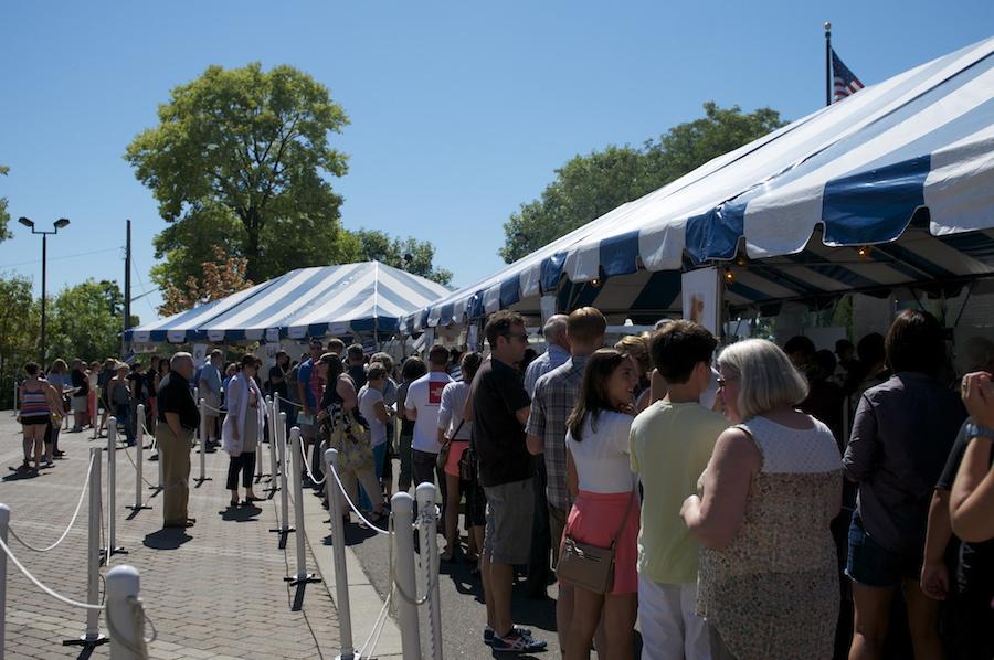 Greek fest attendees wait patiently in line with food tickets to receive traditional Greek delicacies of their choosing.