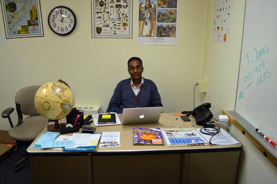 Tarabi+Jama%2C+Somali+Liason%2C+works+at+his+desk+in+the+district+office.