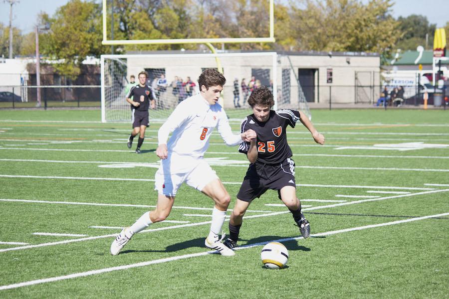 Senior Nicky Owens fights for the ball at the varsity boys soccer game on Sat.,  Oct. 11.  The Orioles won 2-1.