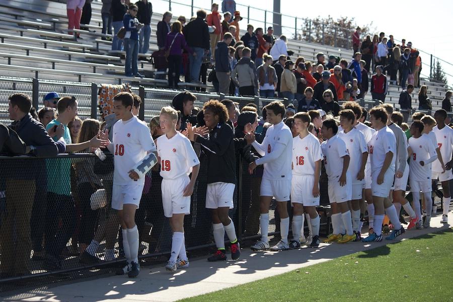 Fans congratulated the boys varsity soccer team after they won against Minneapolis South on Oct. 11.