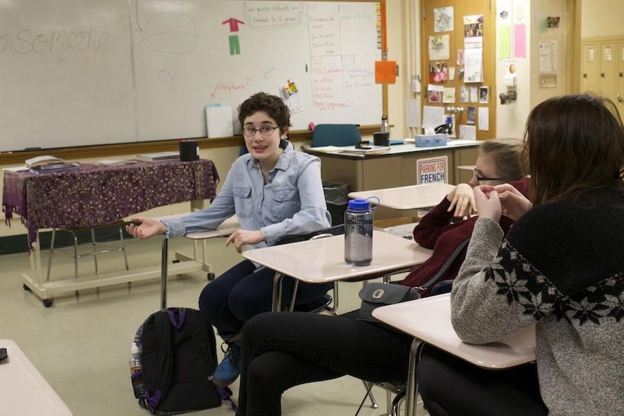 Sophomore Elise Bargman and juniors Nora Sylvestre and Cedar Thomas discuss plans for the new group at the meeting Thursayd Jan. 7.
