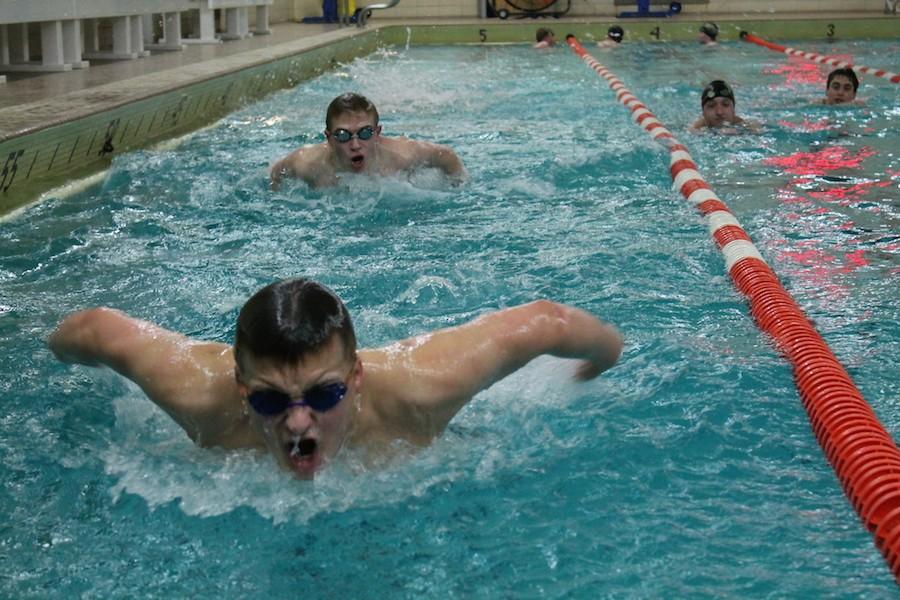 Flying through water: Sophomore Nate Stone practices the butterfly stroke during practice at the high school after school Jan. 7.