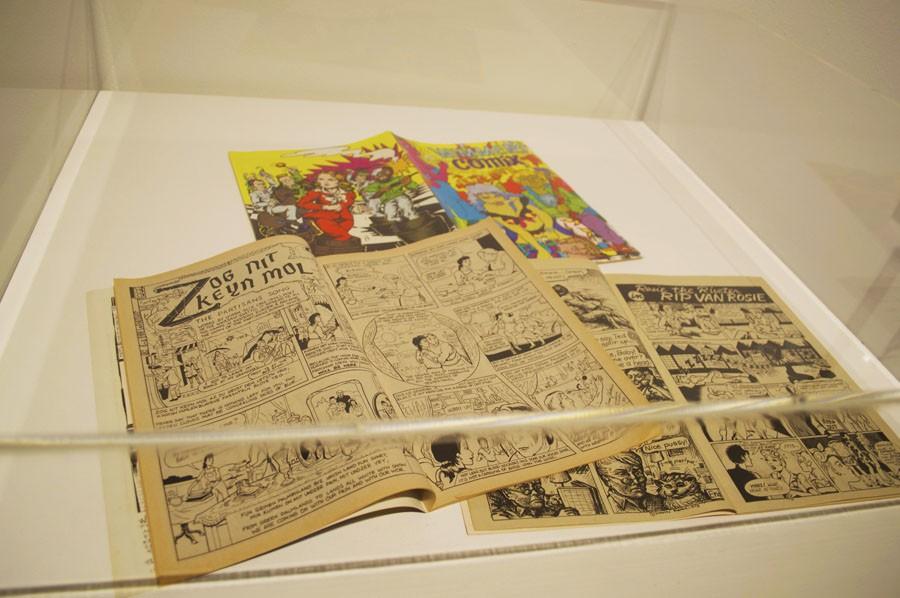 A display case showcases the first ever all-women comic book.