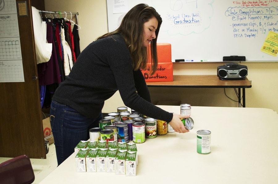 Senior manager Amra Mucic goes through the cans on Feb. 24 after the Natural Helpers vs. DECA food drive competition
