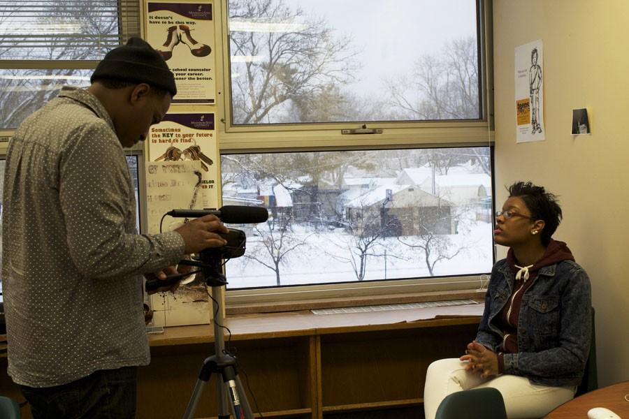 Performance adviser Chris Weaver films senior Donita Edwards for a video for the Black History Month performance Feb. 3.