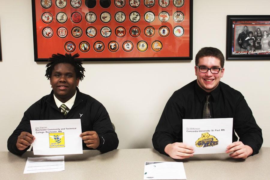 Seniors Joe Warner and DJ Wilkinson pose after singing their letters of intent to play college football at Concordia University- St. Paul and Rochester Community and Technical College.
