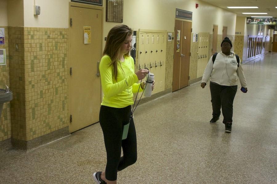 Sophomore Taylor Ewald holds her pass on her way back to class after a trip to the water fountain.