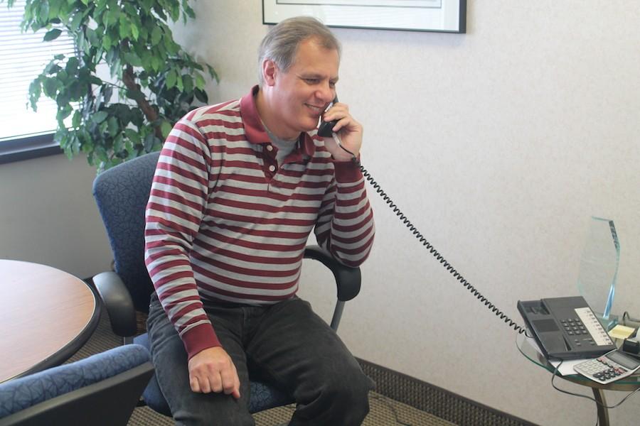 Mayor Jeff Jacobs makes a phone call in his office on March 9. Jacobs served as mayor of St. Louis Park for 16 years.