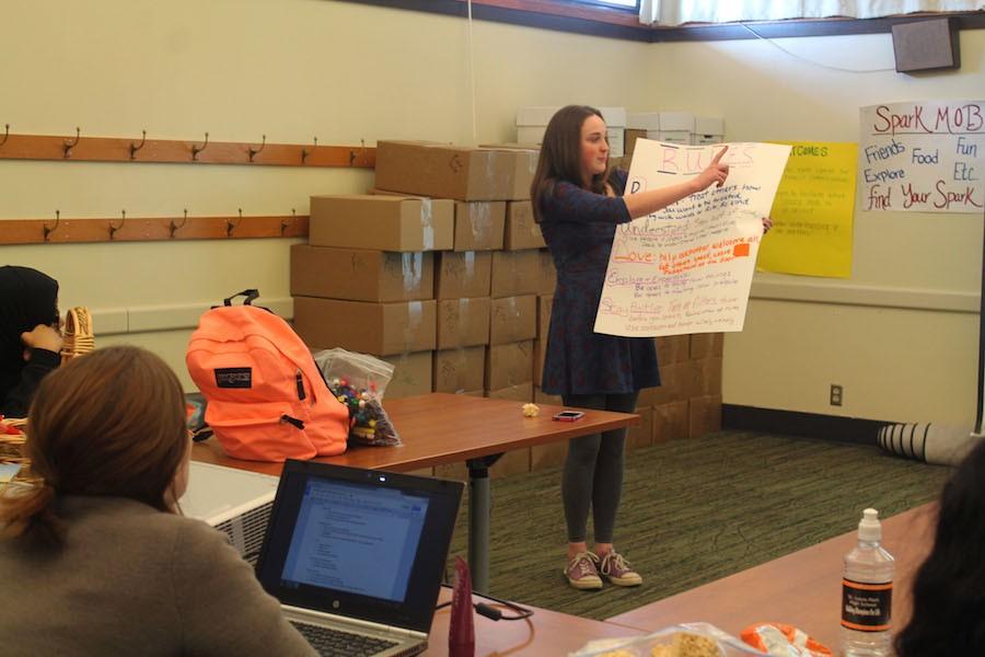 Junior Grace Pelowitz describes the Spark Mob values during their weekly meeting at the public library Feb. 26. 