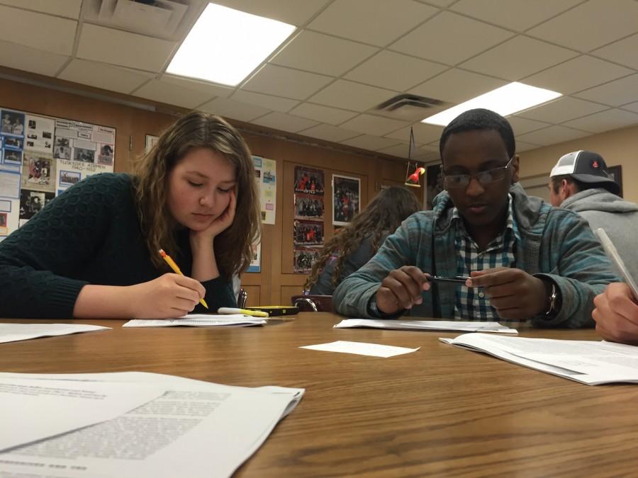 Juniors Zoe Peterson and Hussien Hussein vote for student council representatives during 3rd hour April 30.