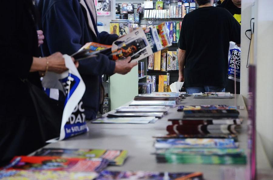 Comic book fans check out free comic books at Dream Vault Games on May 2.