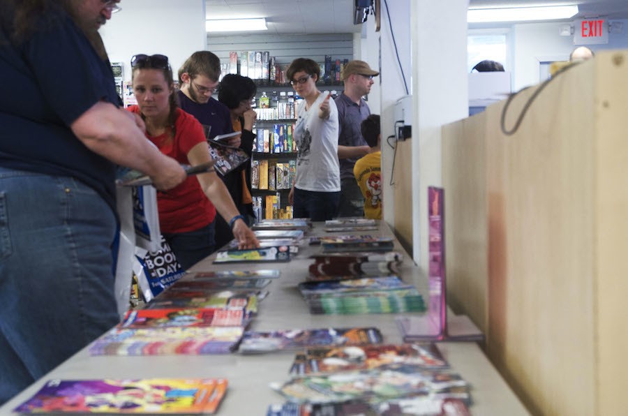 Comic book fans check out free comic books at Dream Vault Games on May 2.