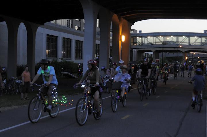 A group of bikers ride during the Greenway Glow night bike ride