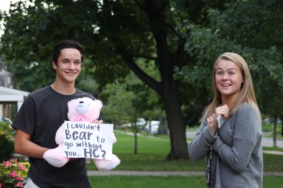 Sophomore David Salamzadeh asks sophomore Lillie Albright to Homecoming with a bear and a sign Sept. 20.