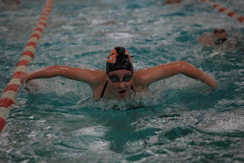 Freshman Sarah Anderson practices the butterfly during practice Sept. 22.