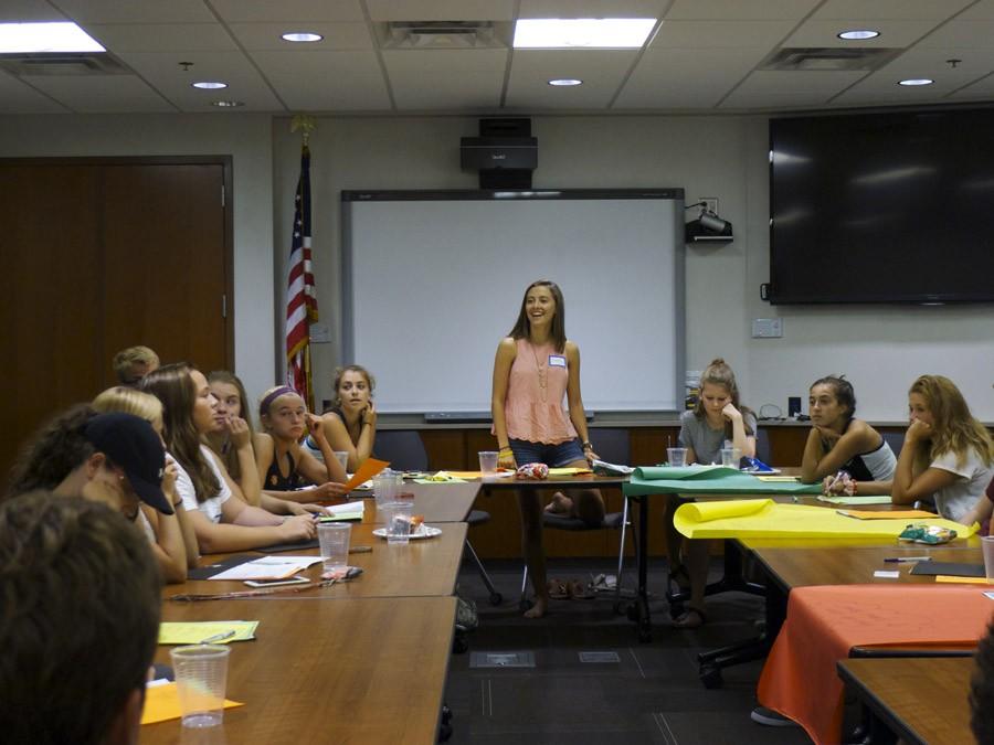 Senior Jessica Schmidt introduces plans for the year to the student council board at a meeting Sept. 1.