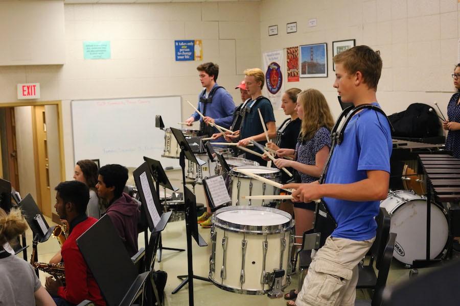 In the band room, Billy Nicholls, Abby Melbye, Grace Williams, Nathan Kempf, Ian Lockhart and Jack Reddan practice their music in anticipation of the pep fest Sept. 25.