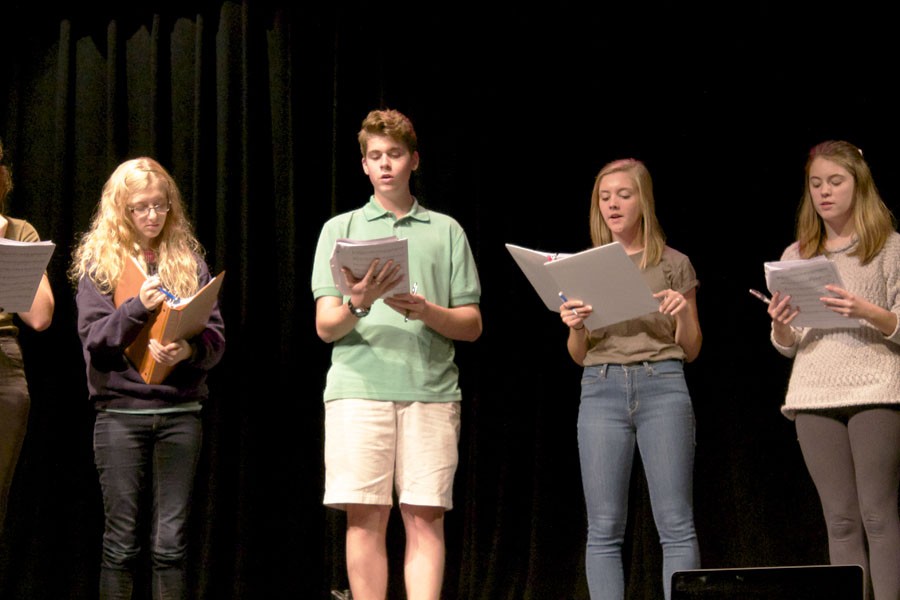 Sophomore Maddie Kapel, senior Connor Williams, freshmen Emma Yarger and Evelyn Nelson run through their lines at rehearsal Sept. 21.