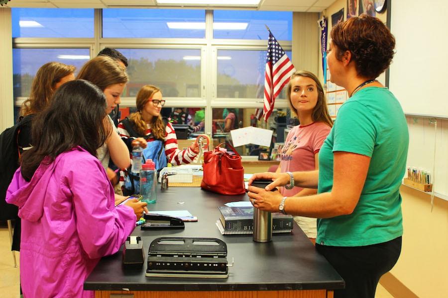 Students chat with adviser Casie Budulfson  about the newly started medical club.
