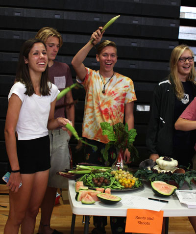 Juniors Jayne Stevenson, Owen Geier, Ethan Brown and Anna Roethler show off the plants they have grown in hopes of attracting more members to their club at the activity fair Sept. 2.