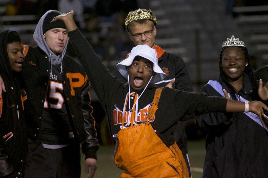 Senior Jonathan Ayele poses during halftime homecoming king and queen announcement.