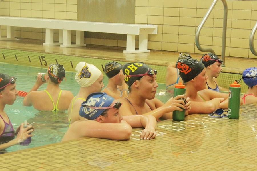 Girls swimming continues to practice in the school pool despite ventilation issues.