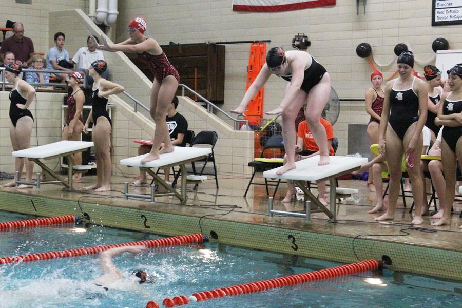 Senior Maggie Lingner prepares to dive in once her teammate hits the wall in their relay Oct. 1.