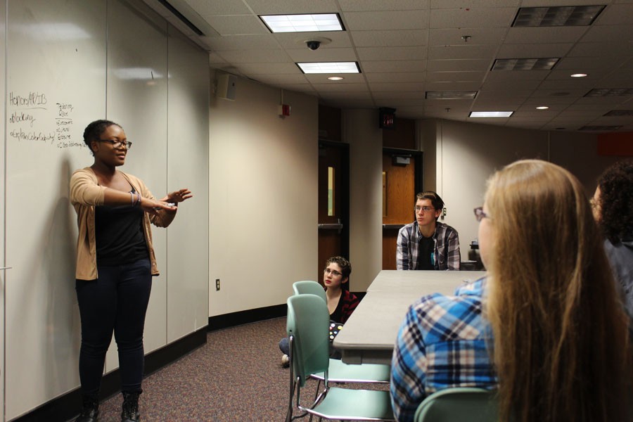 Junior Callia Blake leads a discussion about the groups goals during the meeting Oct. 12.