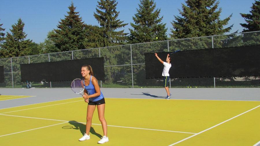 David Salamzadeh and Lillie Albright partner up to participate in the girls tennis fundraiser.