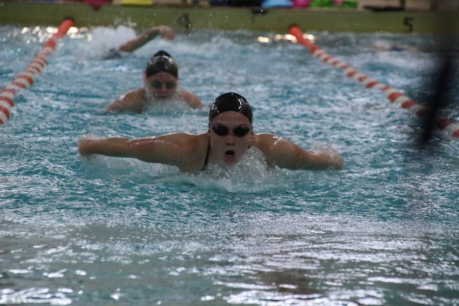 Freshman Mazie Lainsbury practices the butterfly stroke. The team tapered to prepare for sections Nov. 11 and 13.