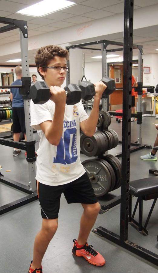 Freshman Nicholas Beaton completes a set of curls in morning strength and conditioning Nov. 19.