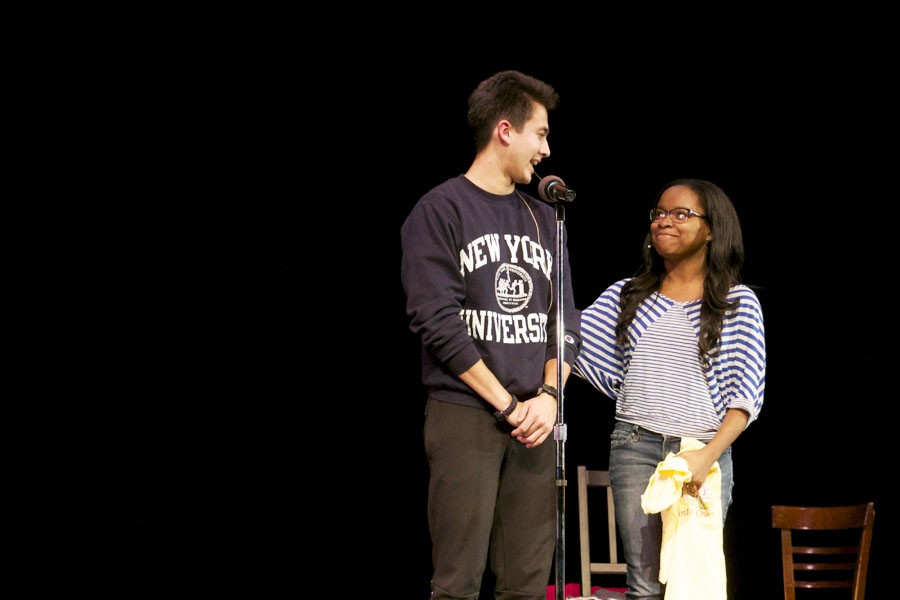 Freshman Chastity Colquitt walks senior Ben Chong off stage for spelling a word wrong Nov. 13.