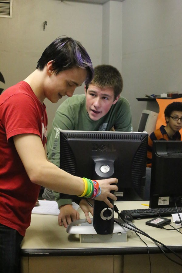 Senior Garrett Briggs helps Junior Karl Ordoff adjust the computer during their meeting.
