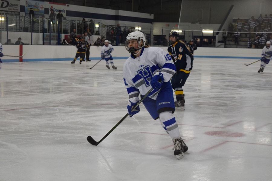 Sliding in: Junior Makayla Jones-Klausing skates towards her team at its game Dec 5.They won 4-1 against Totino Grace.