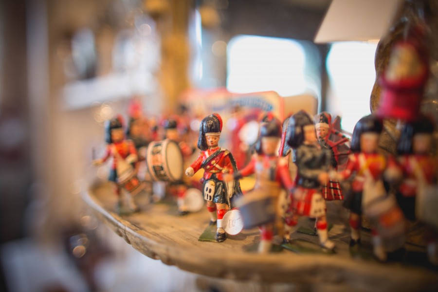 Figurines sit on a shelf at Victory Vintage