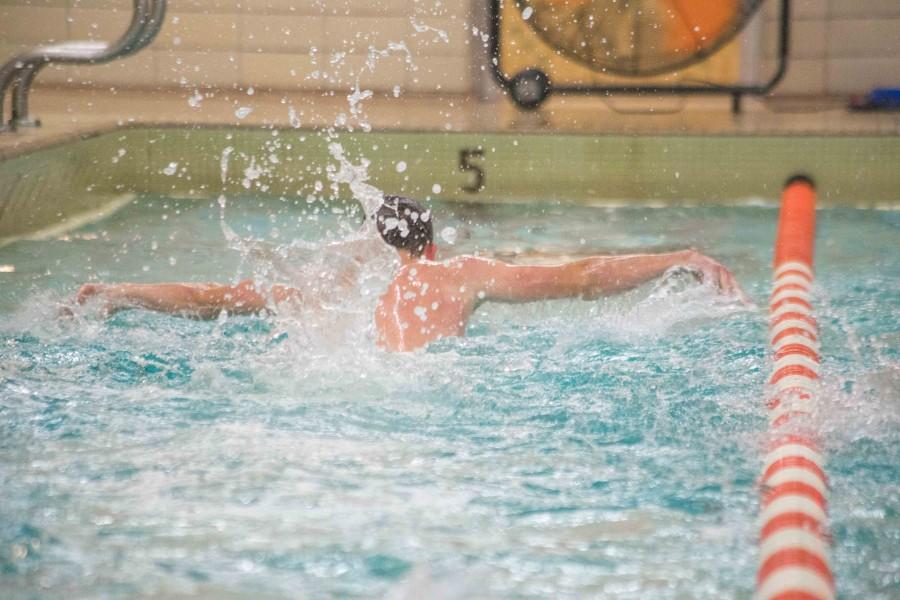 A swimmer practices his butterfly stroke at practice Dec. 3.
