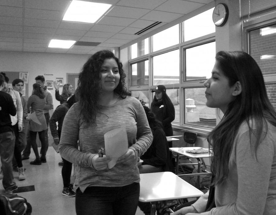 Senior Brenda Hernandez and sophomore Britney Villanueva engage in a skit between French 1 and French 4 during their fourth hour class Dec. 15.
