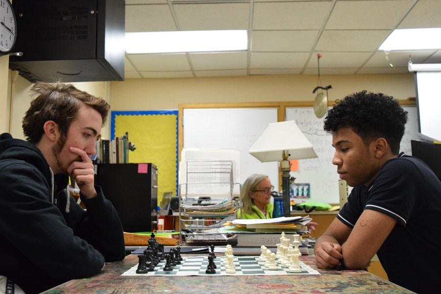 Senior Gavin Druxman and sophomore Justin Wilson practice chess at the meeting Jan. 13, Wilson won. Meeting is held in Mrs. Norris room.
