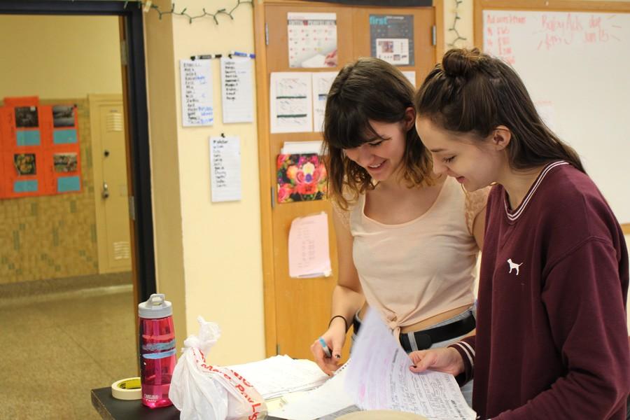 Seniors Paige Pinneke and Martha Sutter copy edit during class.